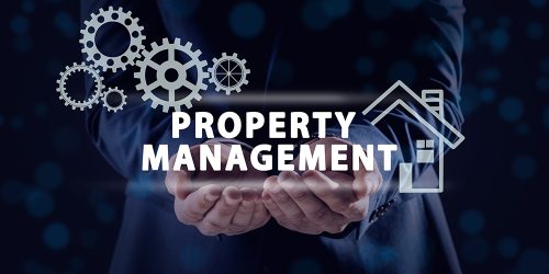 Man Demonstrating Text Property Management And Illustrations On Man demonstrating text Property Management and illustrations on dark background, closeup